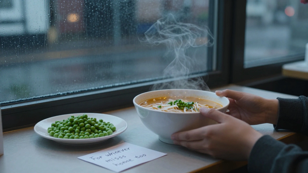 A lone student placing a homemade bowl of pho next to plain British food in an empty cafeteria at dusk.